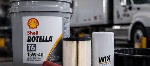 Diesel engine oil and filters ready for a truck oil change